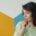 Young woman looking away nervously, a common sign of social anxiety