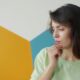 Young woman looking away nervously, a common sign of social anxiety